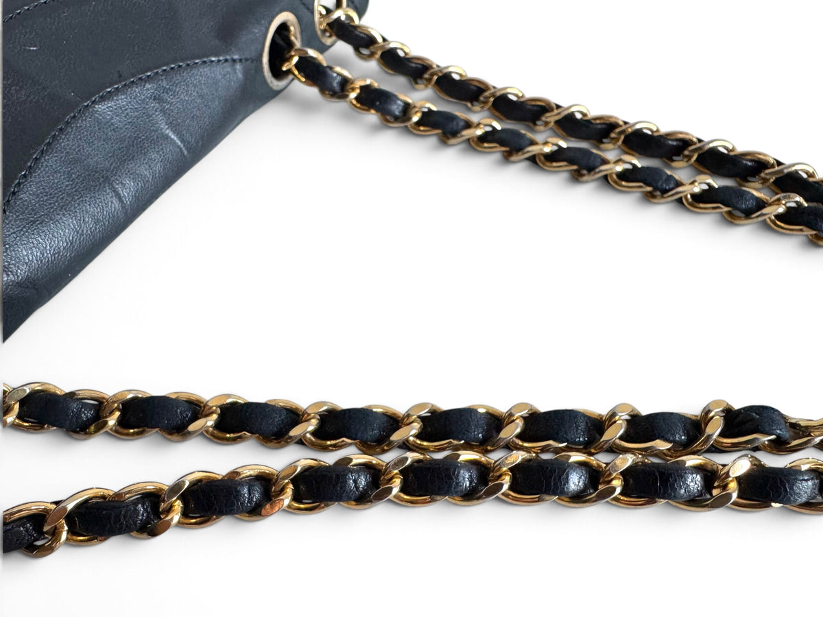 CHANEL Lambskin Half Moon Flap Bag